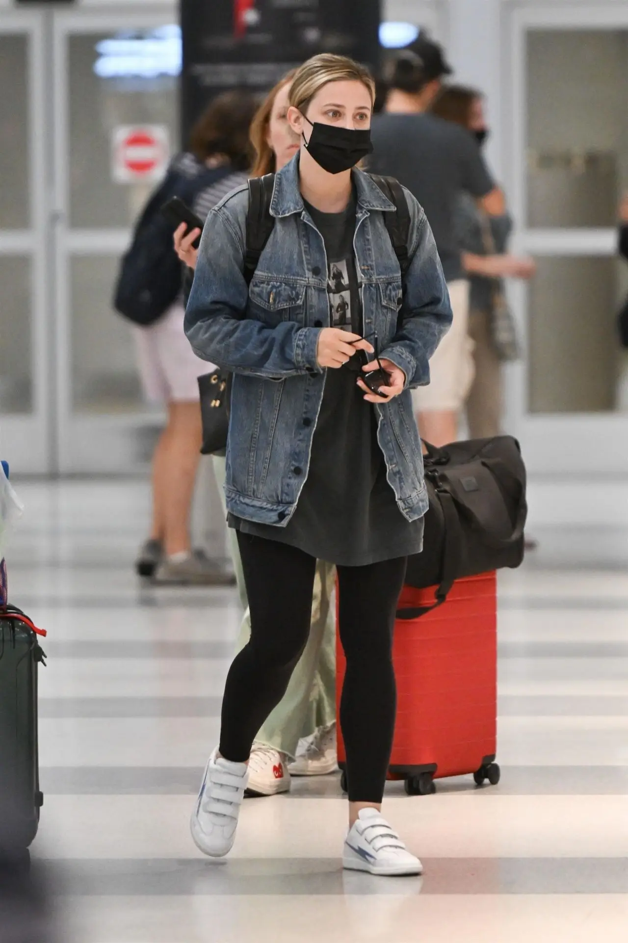 LILI REINHART STILLS AT JFK AIRPORT IN NEW YORK